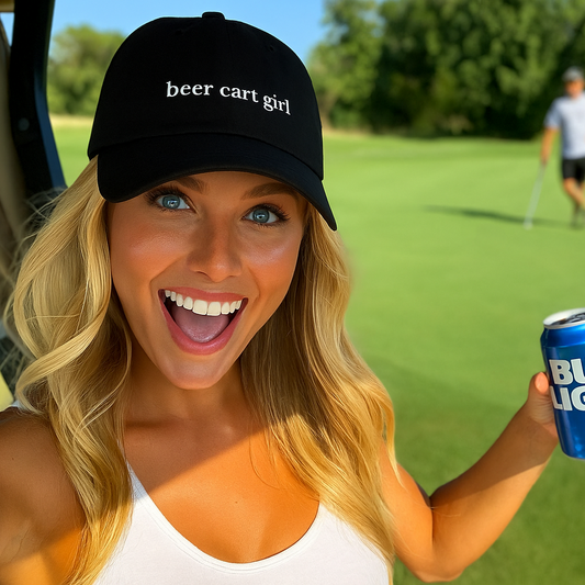 Woman on a golf course holding a Bud Light can, wearing a 'beer cart girl' cap.